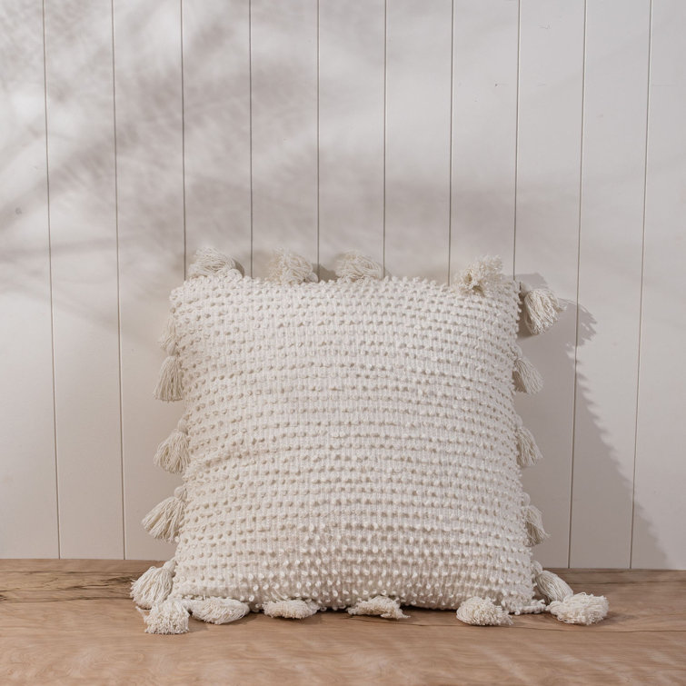 White pillow with clearance tassels